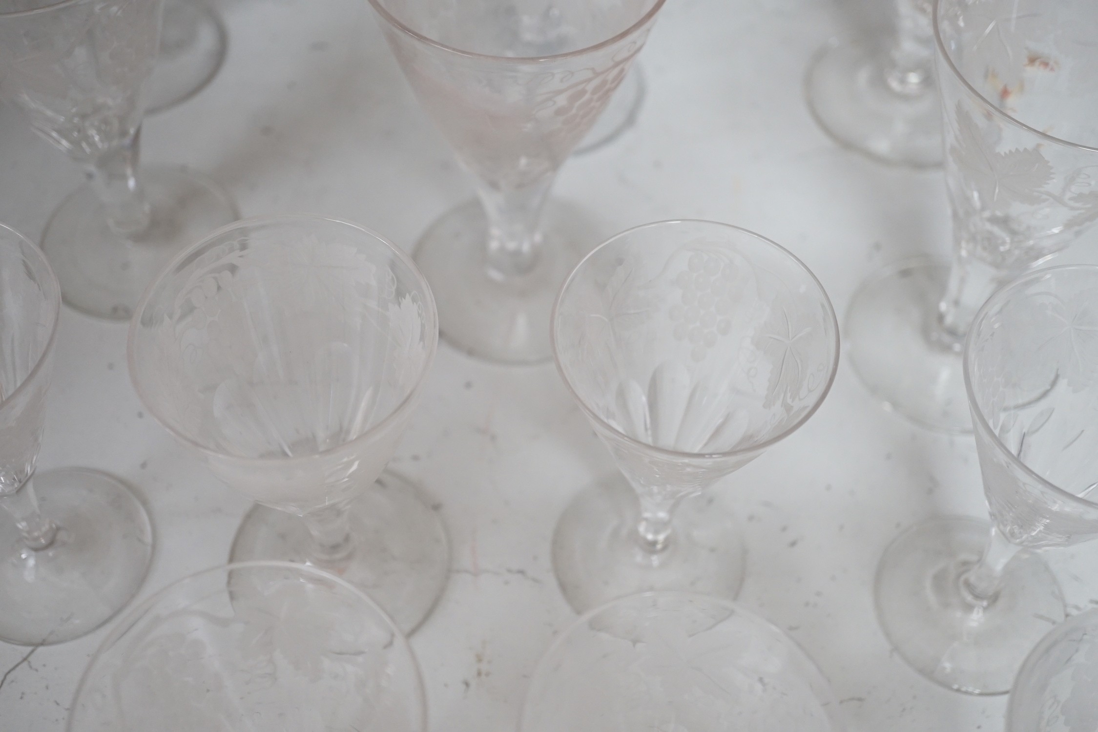 A part suite of Edwardian vineous etched glasses. Tallest 15cm